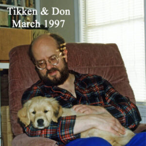 Don and his dog Tikken on his lap